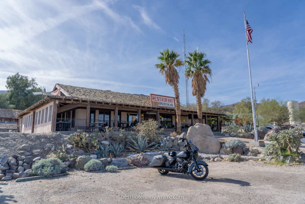 Panamint Springs Motel western style rustic accommodation with motorbike out front on a sunny day
