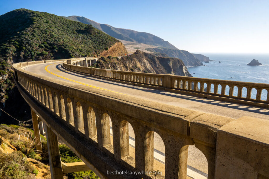 Bixby Bridge close up on the California coast bending curving bridge with view over Pacific Ocean and coastline