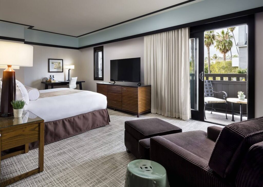 Posh hotel bedroom with sofa bed and large window Ambrose one of the best hotels in Los Angeles Santa Monica