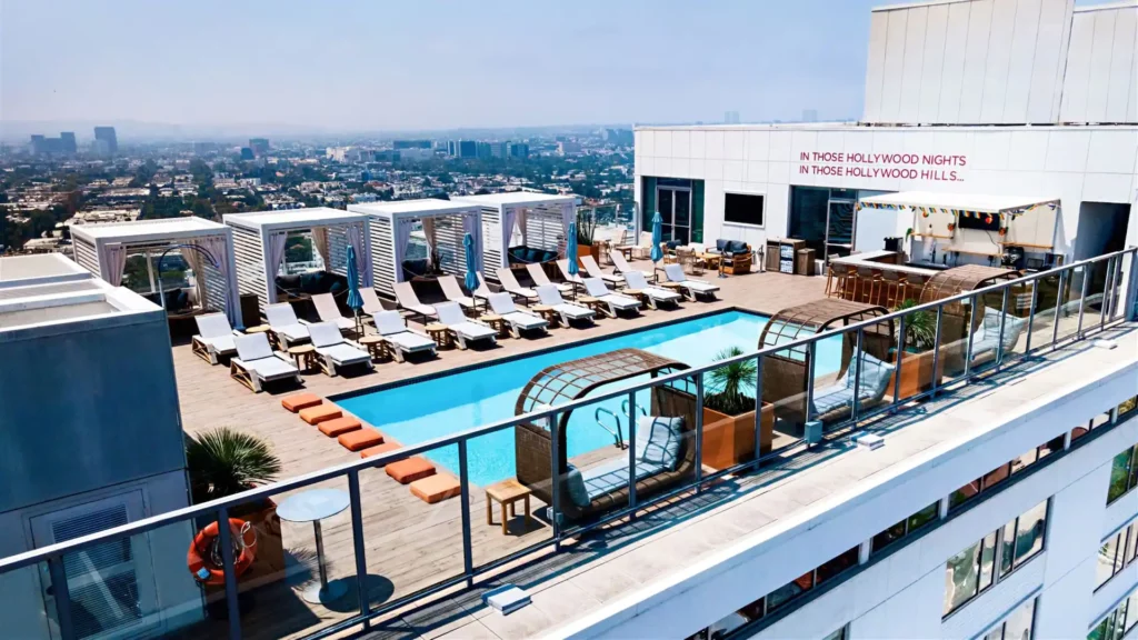 Rooftop swimming pool with sun loungers in narrow line at Andaz one of the cheaper mid range hotels in West Hollywood Los Angeles