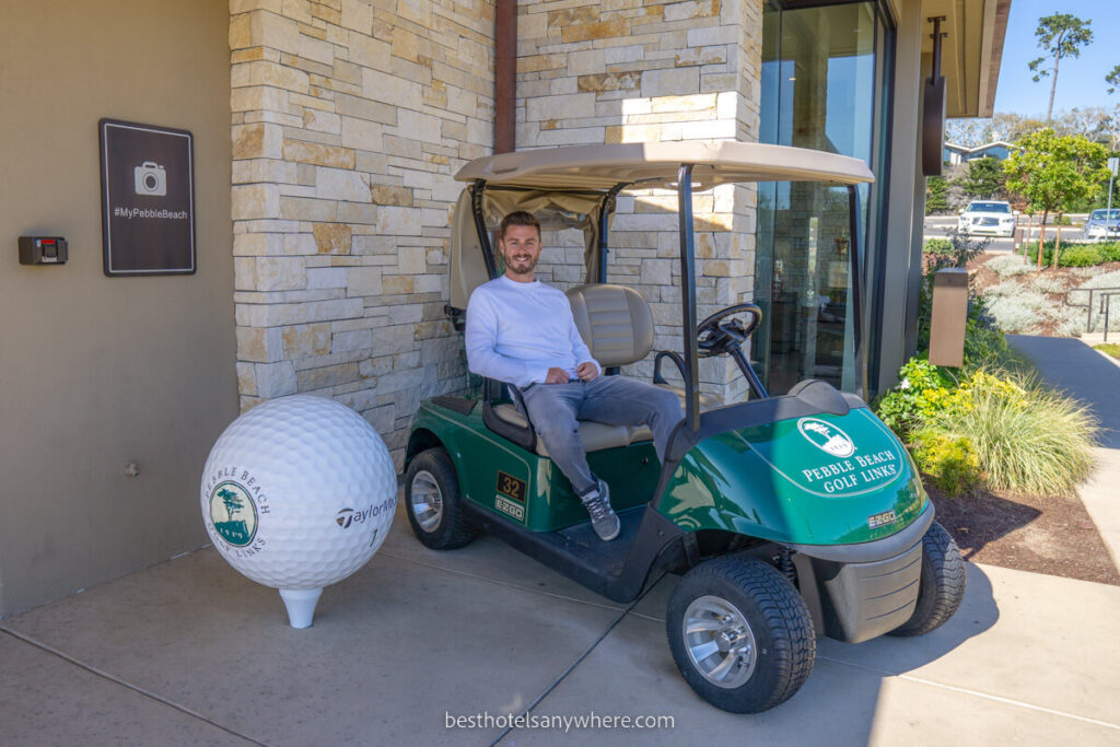 Man sat in golf cart next to photo spot at Pebble Beach golf club