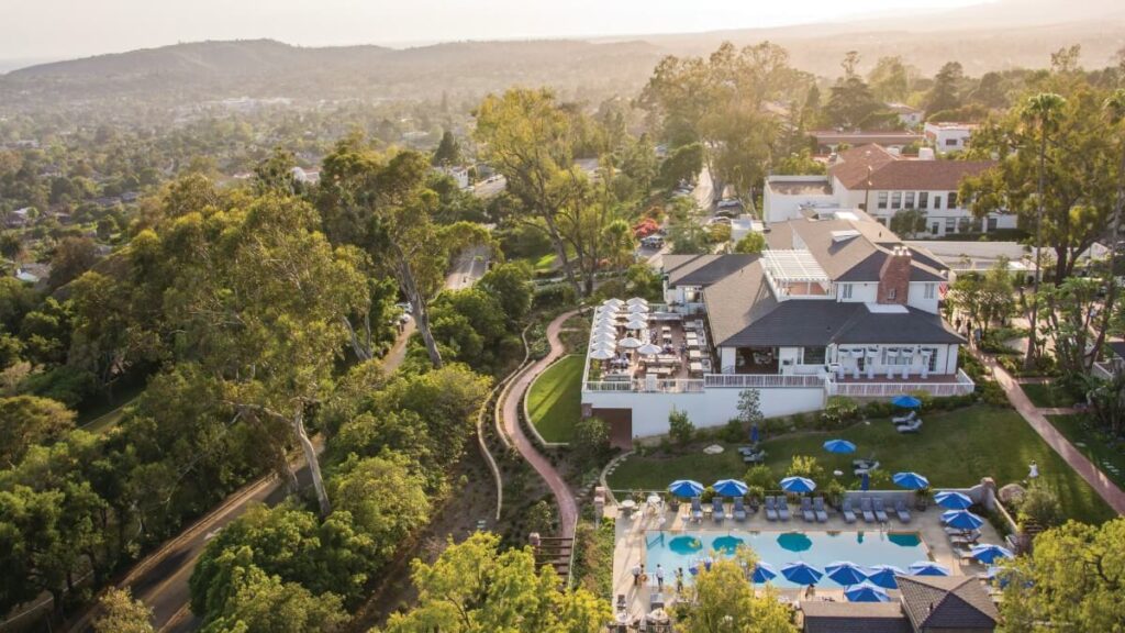 El Encanto by Belmond 5 star luxury hotel in the hills outside of Santa Monica drone photo of the complex at sunset