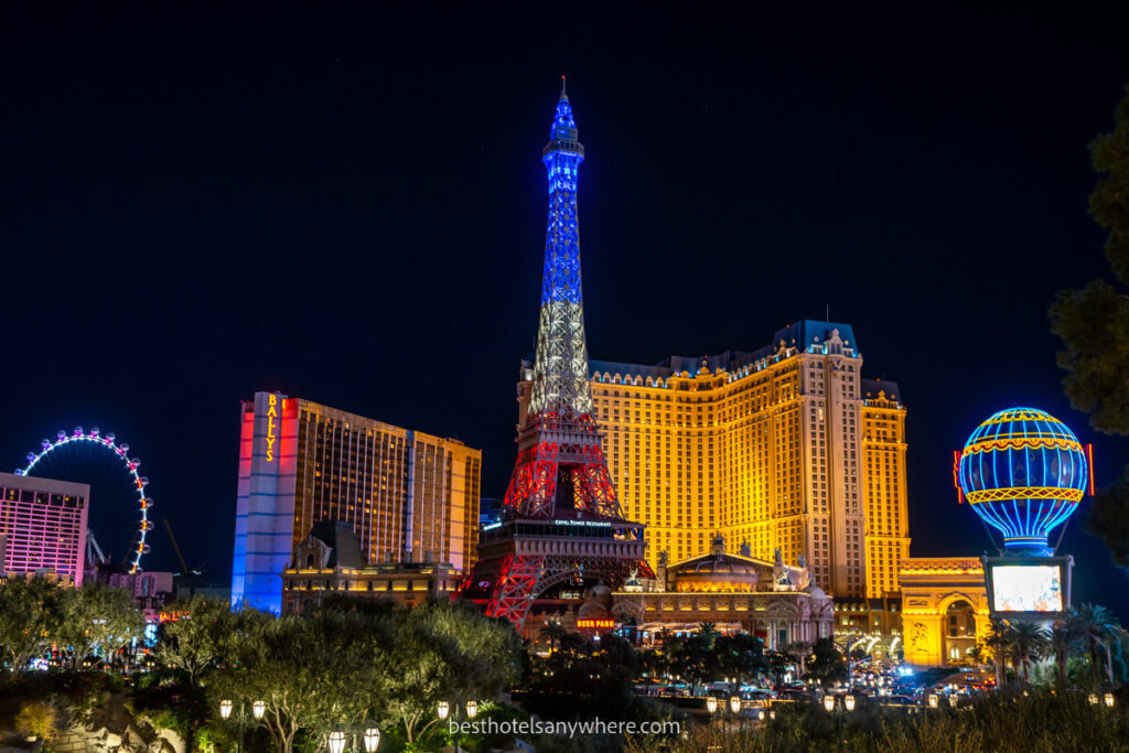 Paris Las Vegas hotel lit up at night with eiffel tower and balloon one of the more popular mid range Las Vegas hotels on the Strip