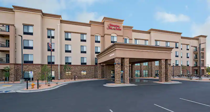 Exterior photo of the Hampton Inn hotel in Page AZ on a sunny day