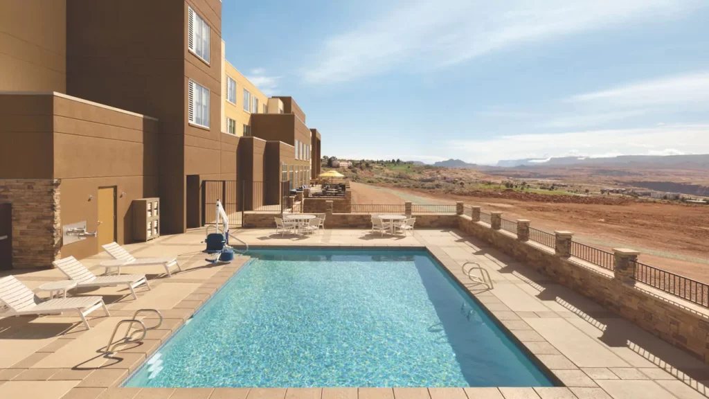 Swimming pool and sun loungers in a desert setting