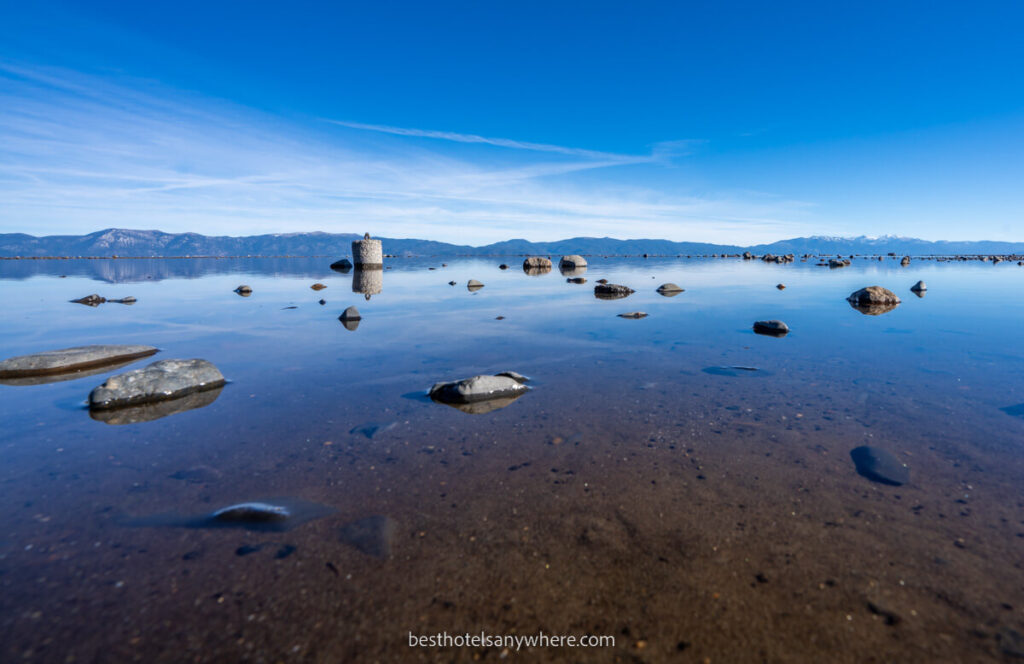 Lake Tahoe with mountains in background photo taken from low down close to the water