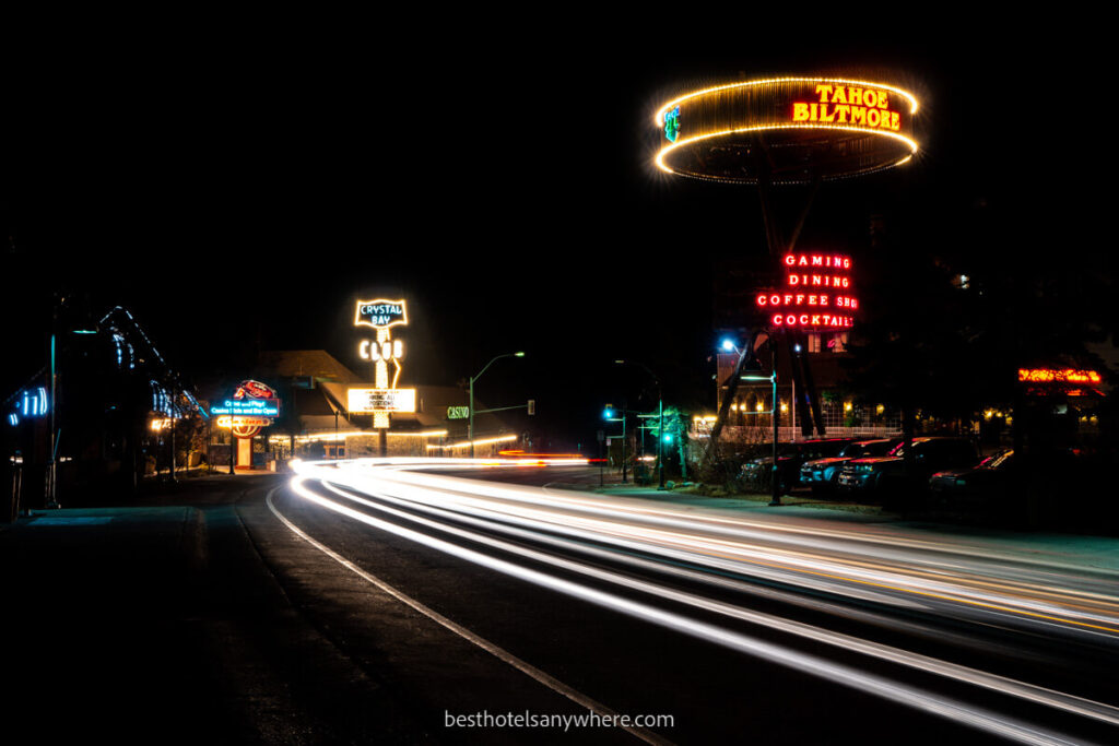 Casino neon lights and car light trails at night in Crystal Bay NV