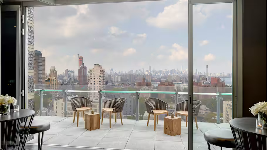 Terrace with chairs overlooking New York skyline