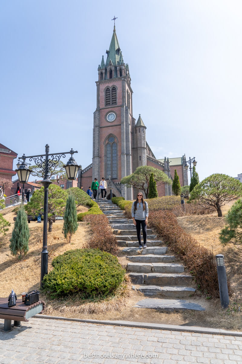 Tourist stood on steps outside Myeongdong Cathedral