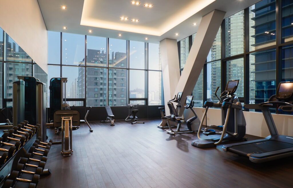 Upscale fitness center with treadmills and weights in a hotel
