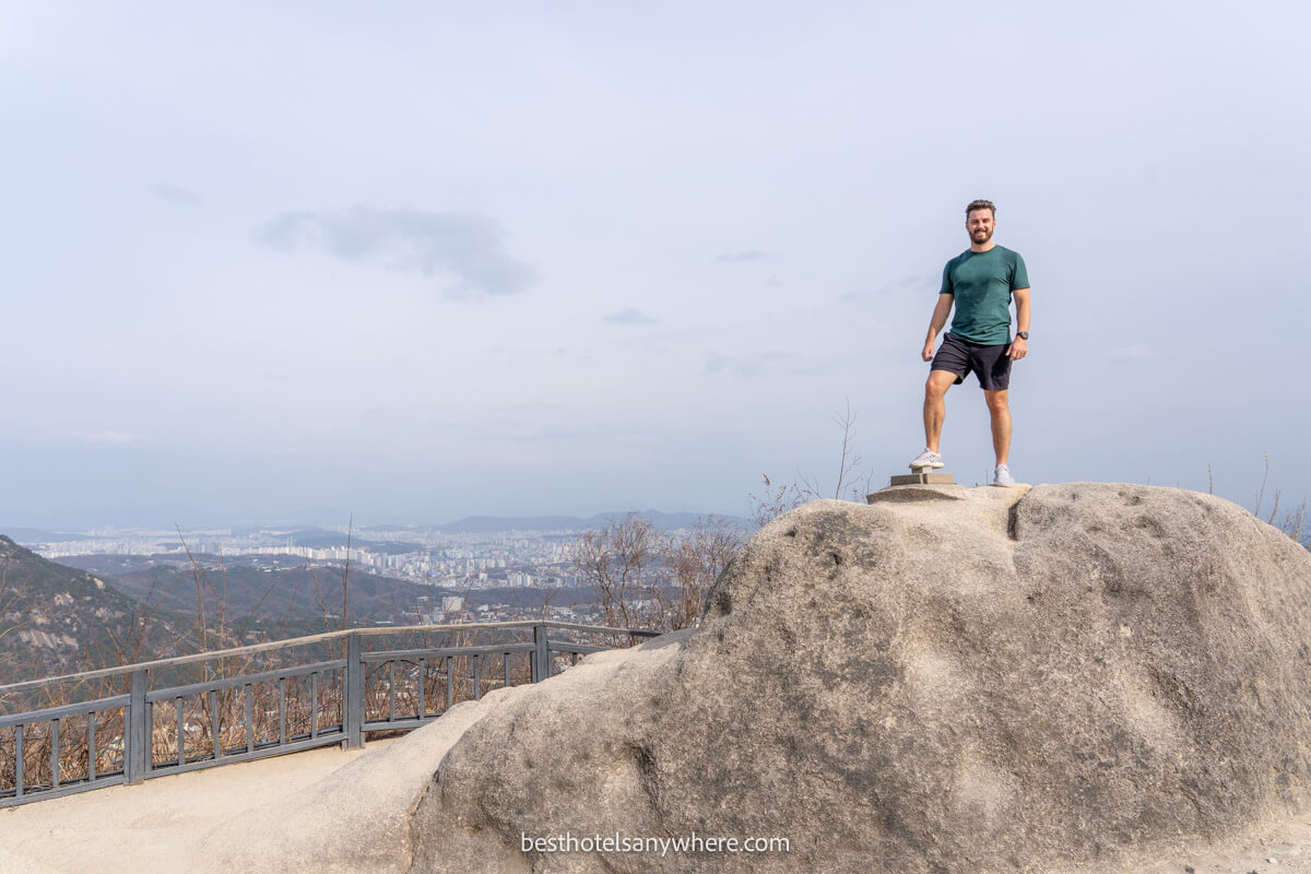 Hiker stood at the top of Inwangsan Peak in Seoul