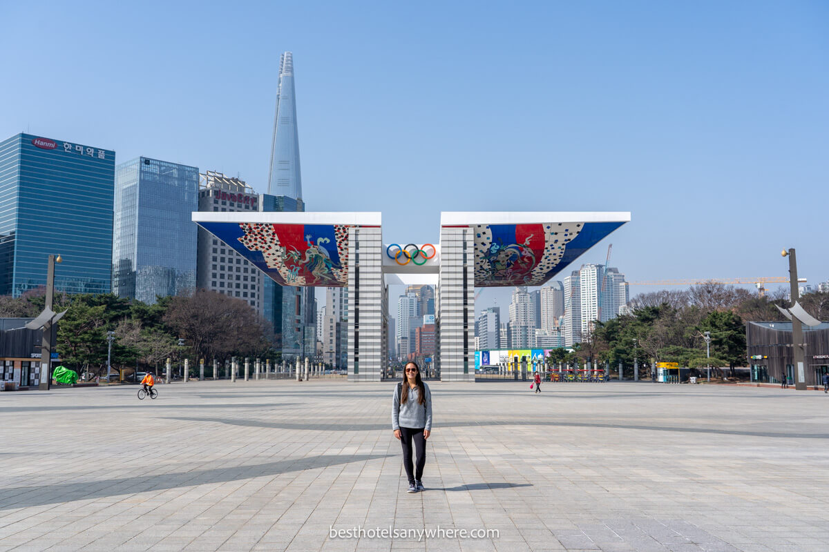 Tourist standing in front of the Olympic Park Sculpture in Gangnam Seoul