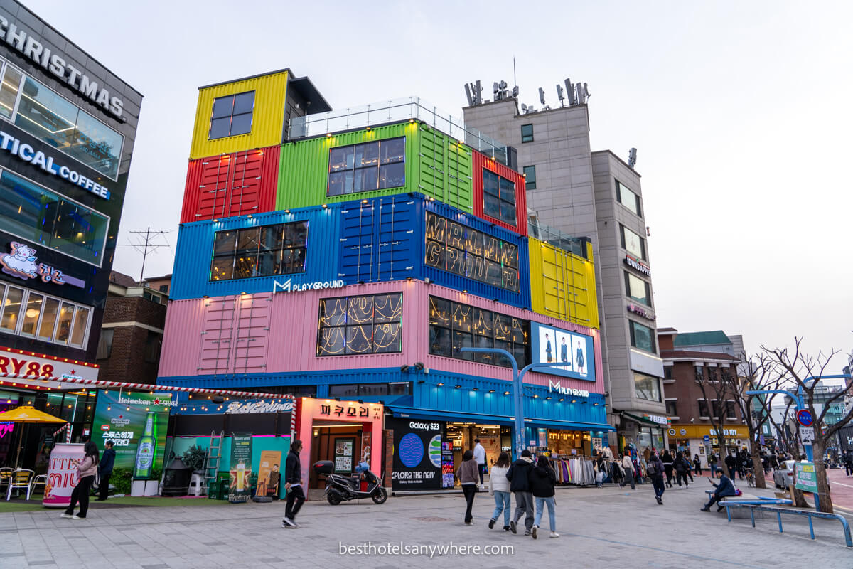 Shopping and dining area in Hongdae Seoul with colorful facades on buildings
