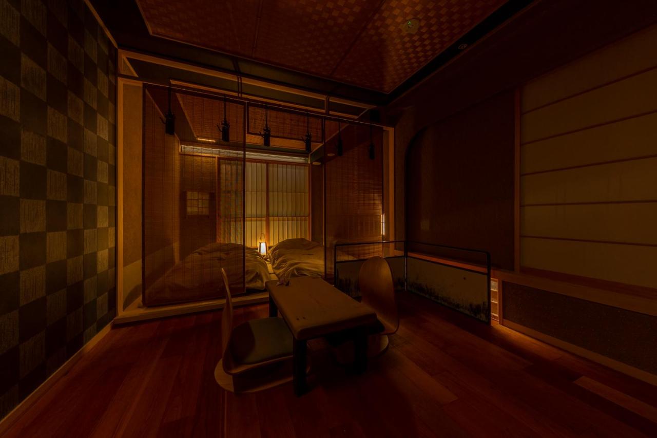 Inside a traditional Tokyo ryokan with tatami floor and dim lights