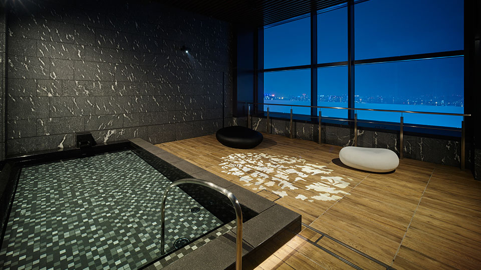 Public hot spring bath onsen at a hotel in Tokyo Japan at night