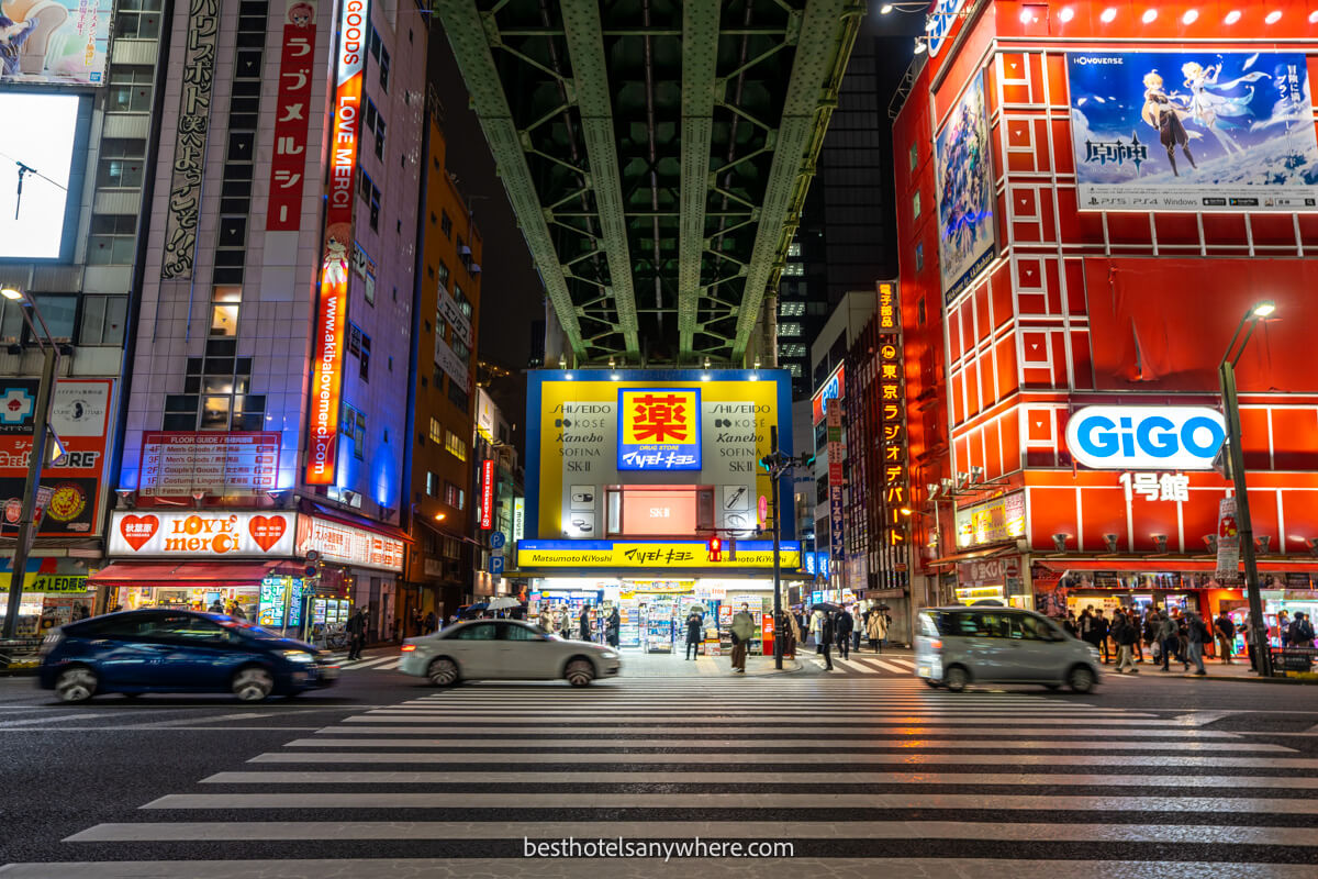 Bright neon lights and a pedestrian crossing in Akihabara Tokyo at night