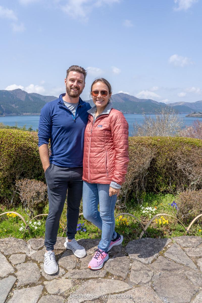 Couple standing together in Hakone with Lake Ashi and Mt Fuji in the background