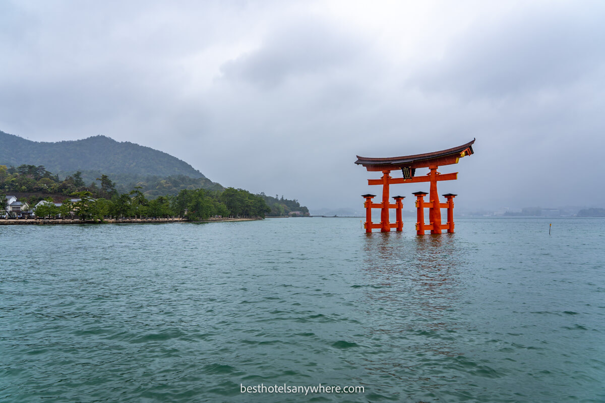 Miyajima Island grand tori gate out in the water on a cloudy day