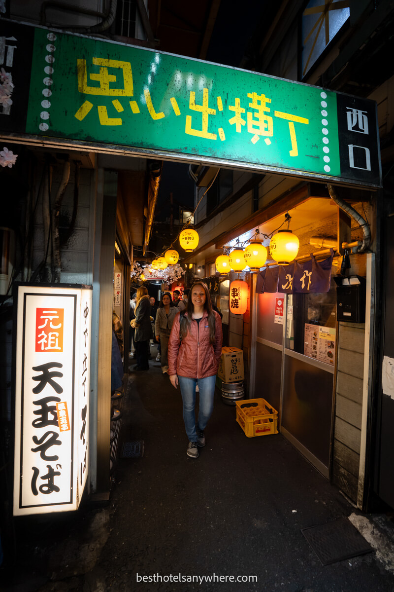 Tourist entering Omoide Yokocho in Tokyo Japan at night
