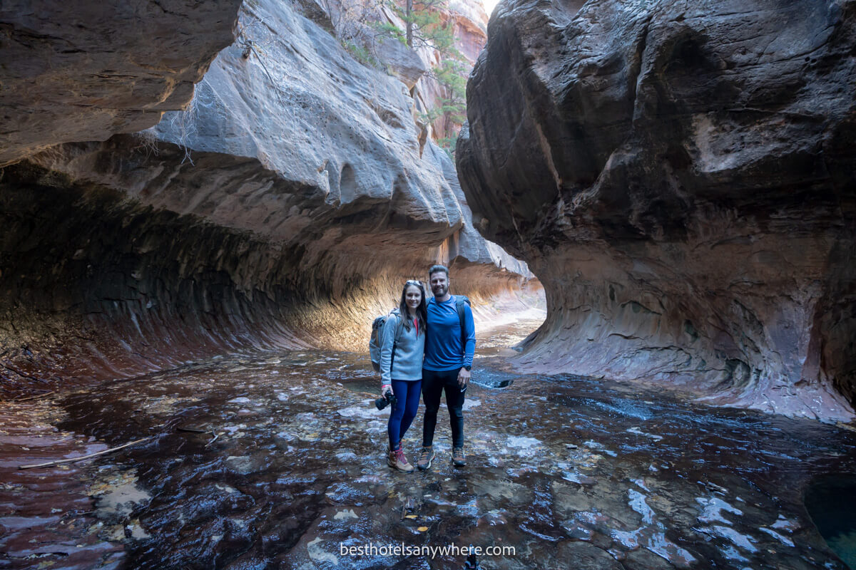Photo of a couple standing together at The Subway in Zion National Park