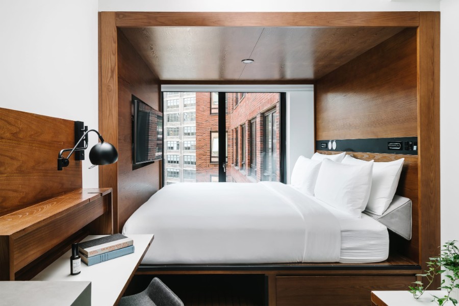 Guest room with bed and wooden furniture at a hotel in SoHo NYC