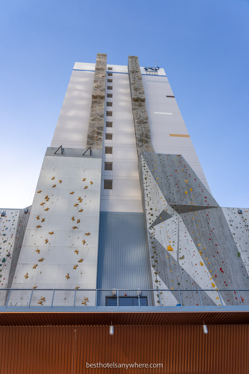 Exterior photo of Whitney Peak Hotel in Reno with climbing wall scaling the outside of the tall building