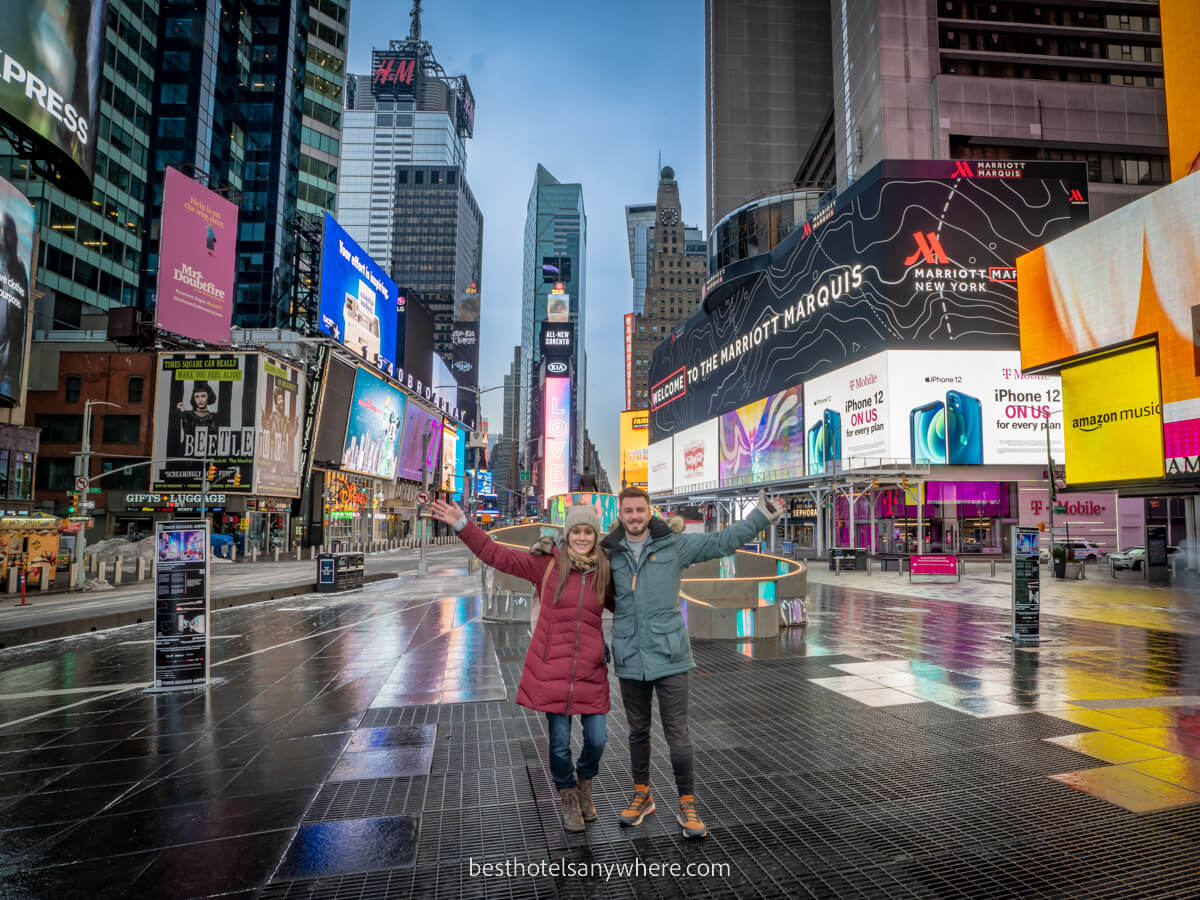 Mark and Kristen Morgan from Best Hotels Anywhere in Times Square NYC alone at dawn with flashing lights and no people