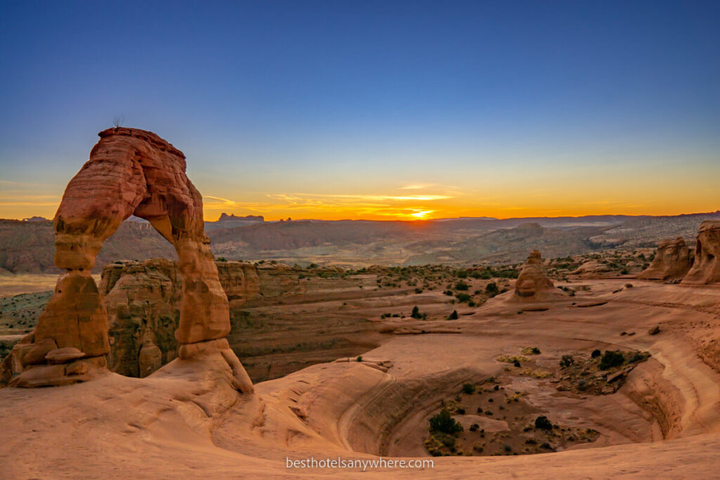 Delicate Arch at sunset in Arches National Park Utah deep blue sky