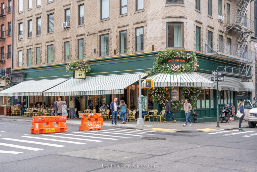 Exterior photo of a restaurant in SoHo NYC with road blockings for pedestrians