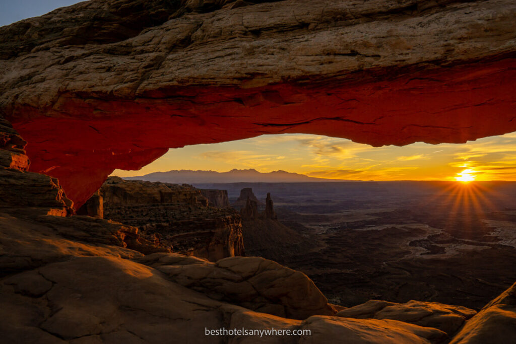 Sunrise through Mesa Arch in Canyonlands Utah stunning soft light glowing on the arch