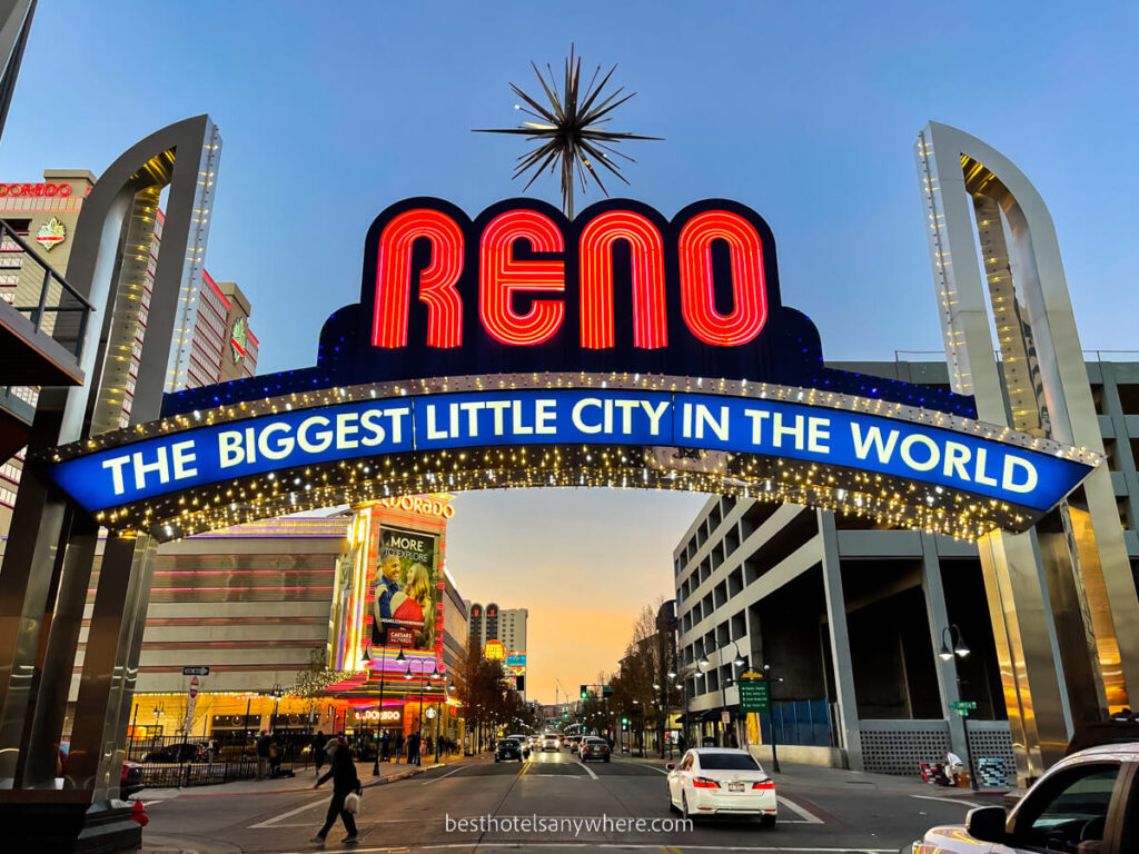 The famous Reno Arch lit up red and blue at sunset in nevada