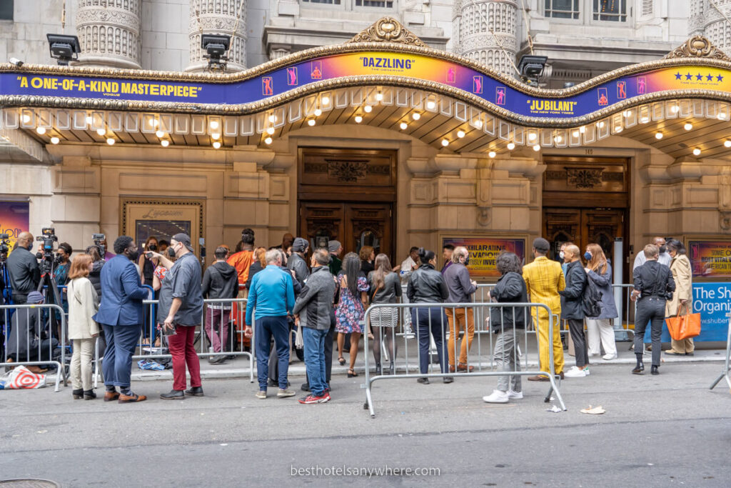 Outside a theater show with huge crowds gathering